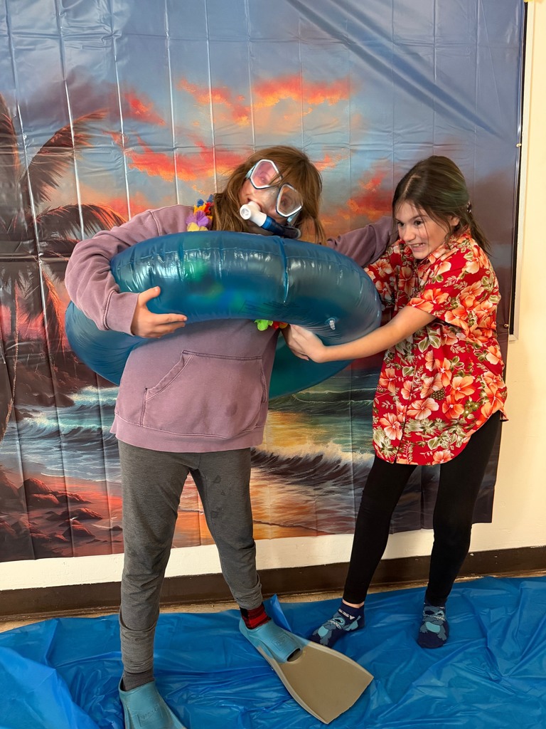 students posing at the beach