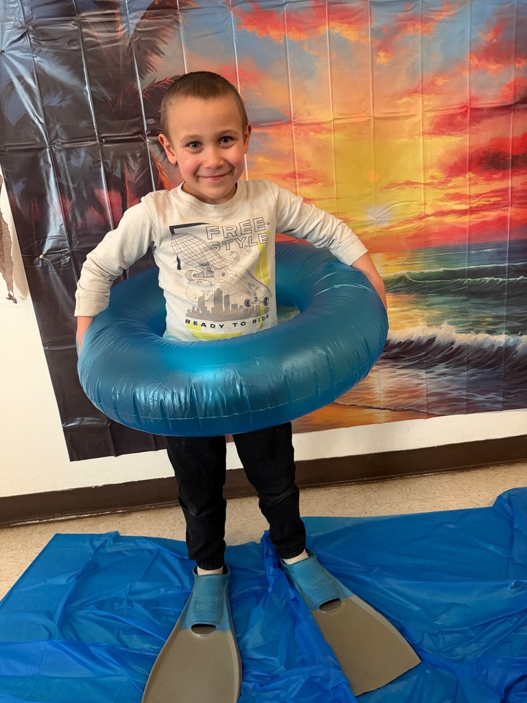 students posing at the beach