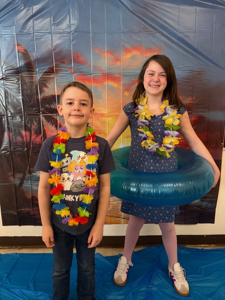 students posing at the beach