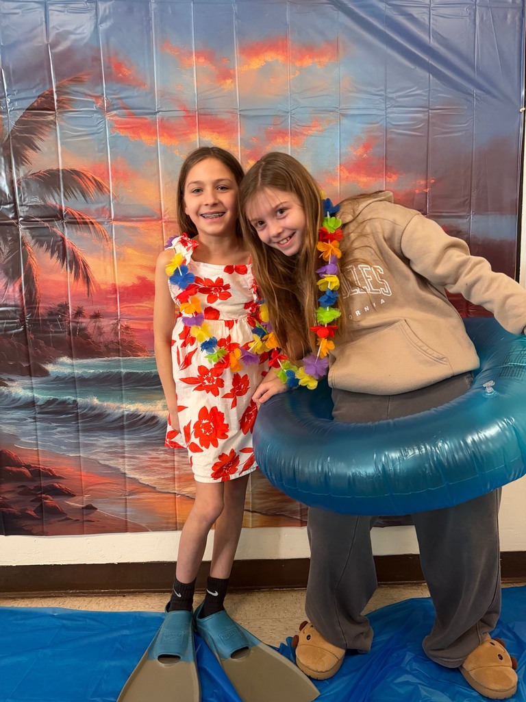 students posing at the beach