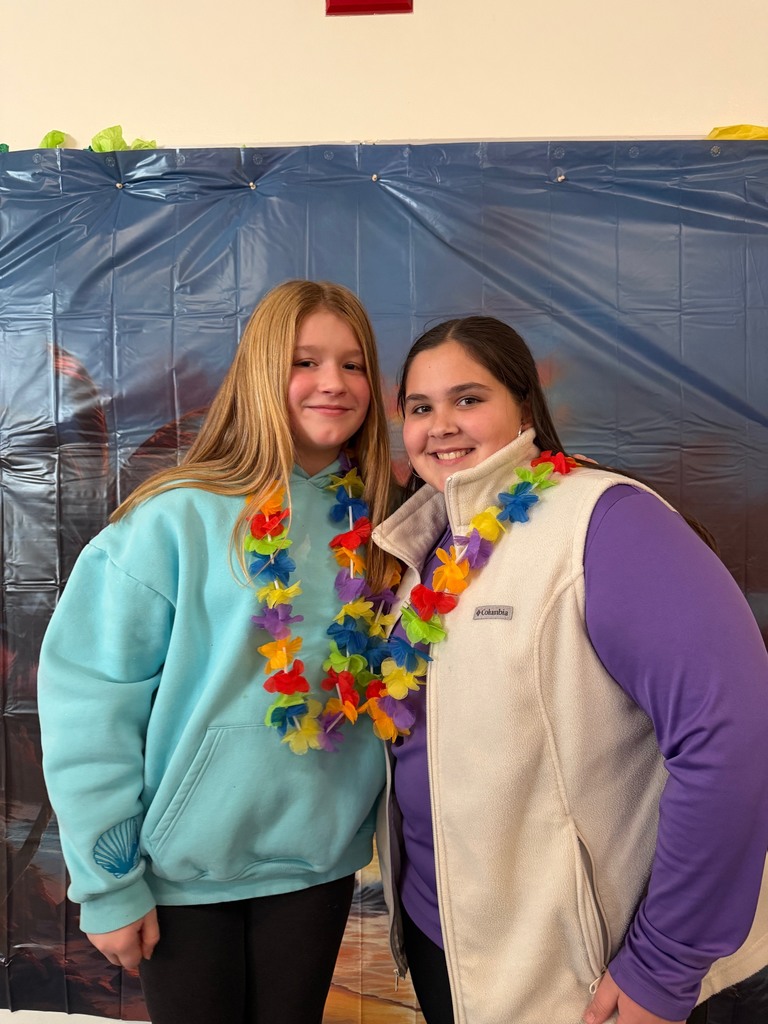 students posing at the beach