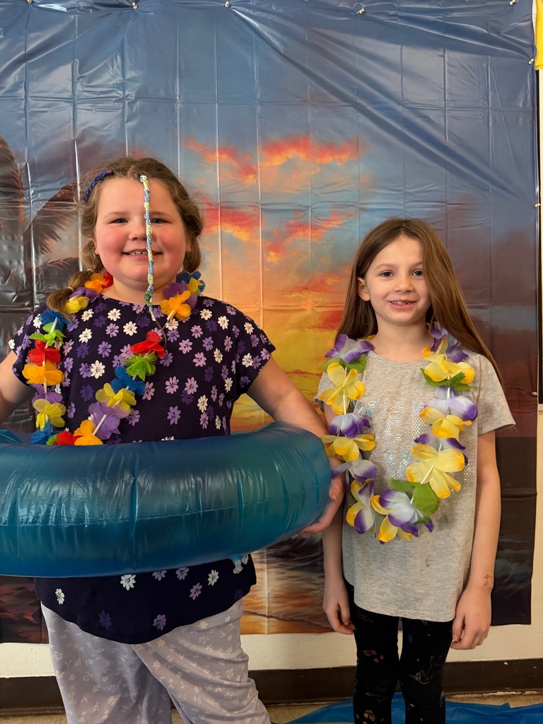 students posing at the beach