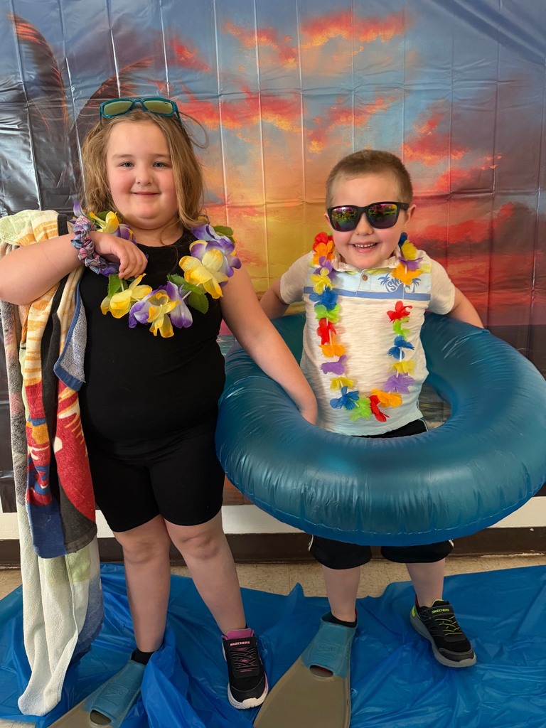 students posing at the beach