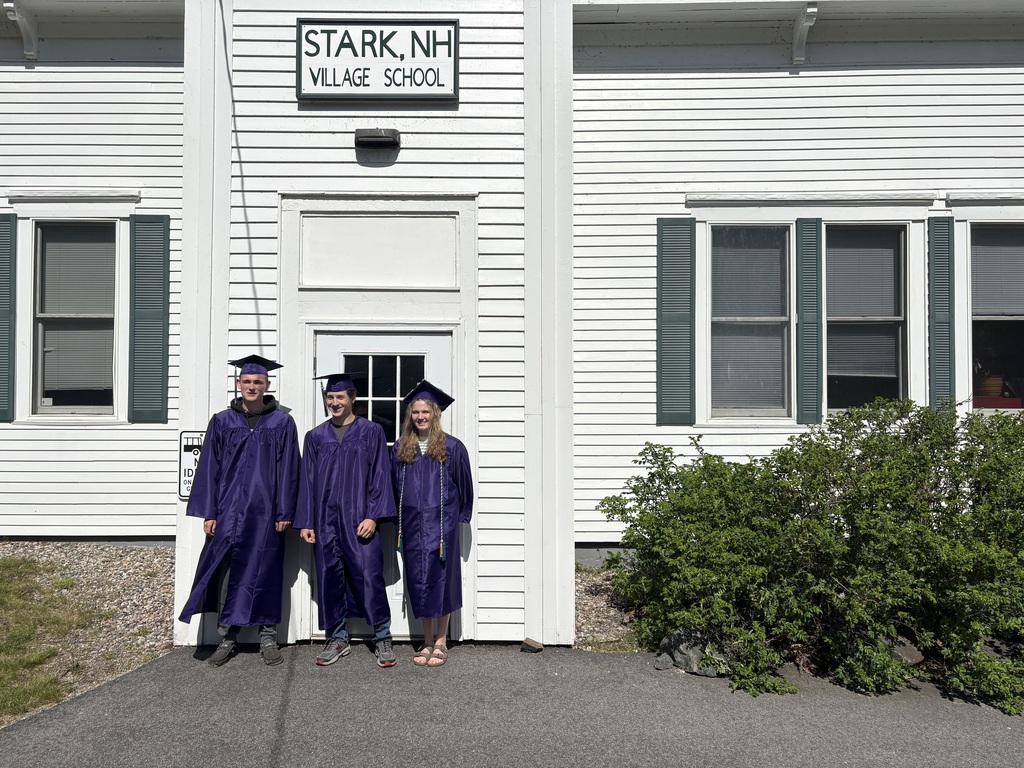graduating seniors standing outside school