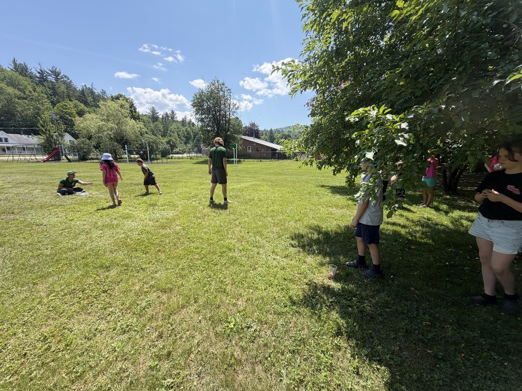 Students playing in field