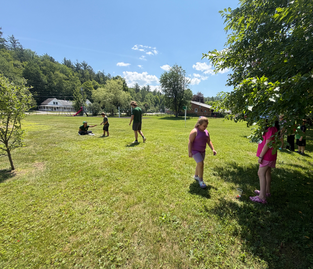 students playing game in field 