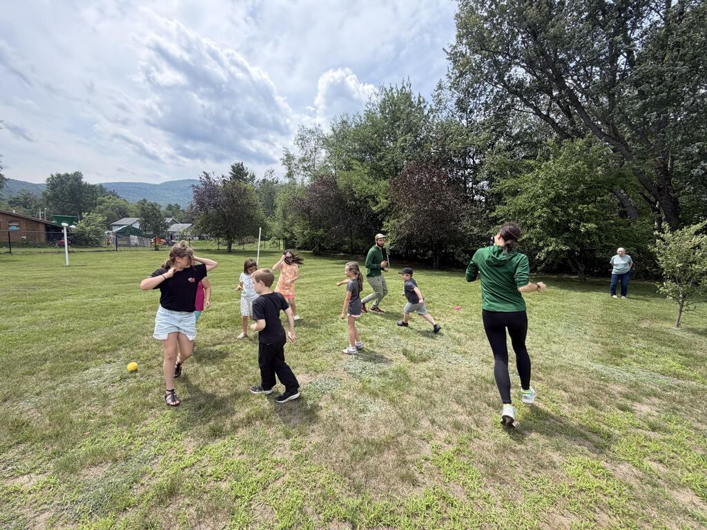 Students playing game in field