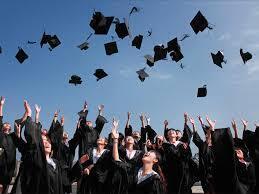 graduate throwing hats in air