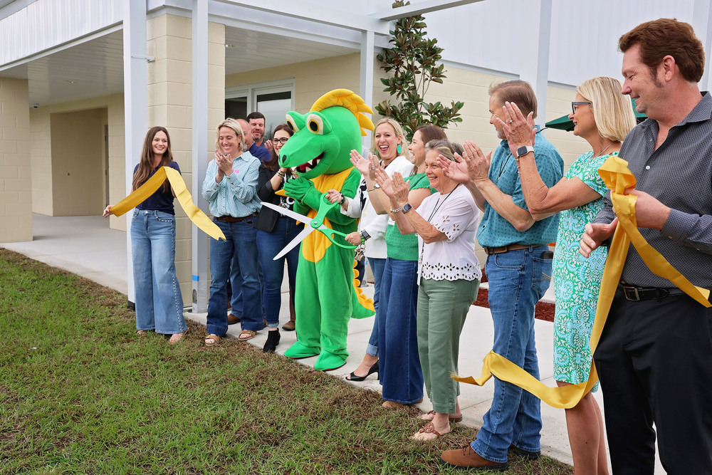 Ribbon cutting with staff