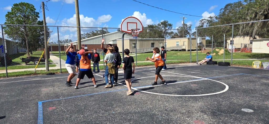 students playing basketball