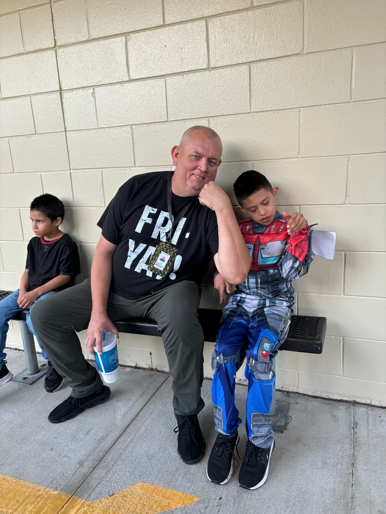 Mr. John's and a student at the costume parade
