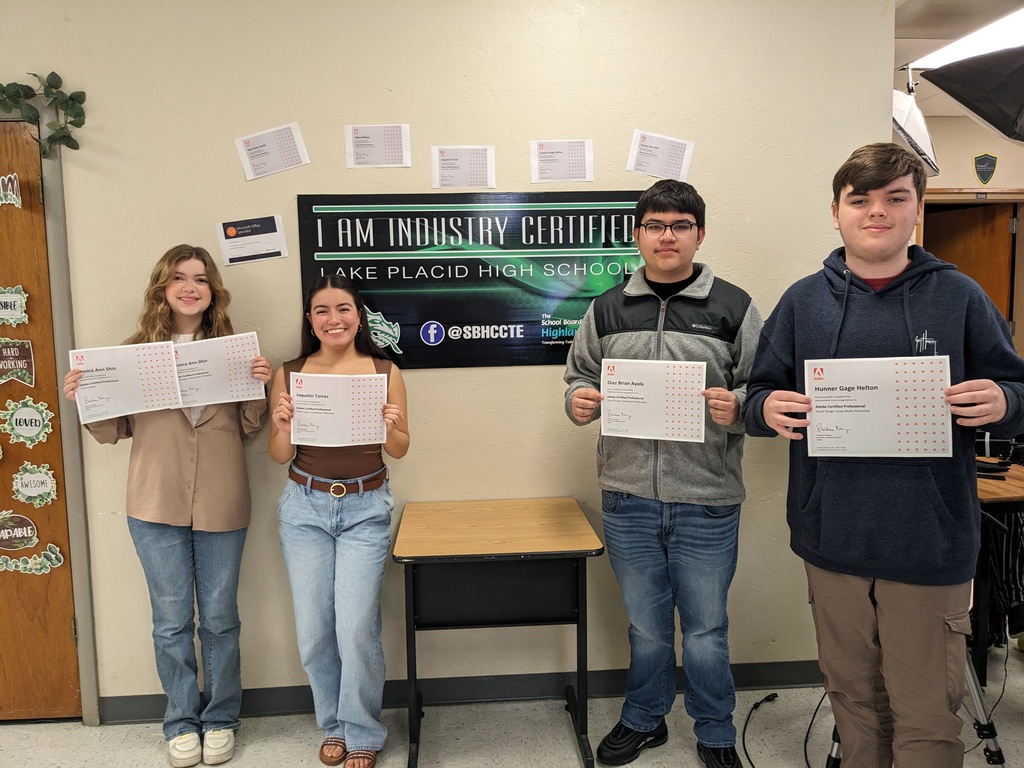 Students holding certificate.