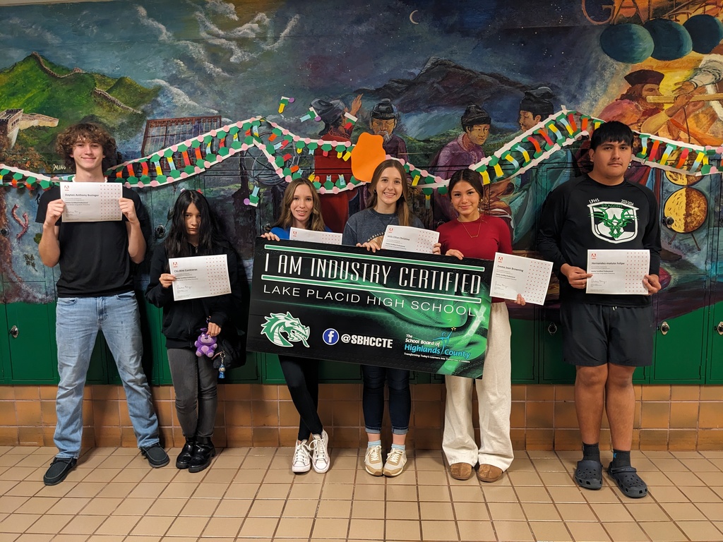 Students holding certificate.