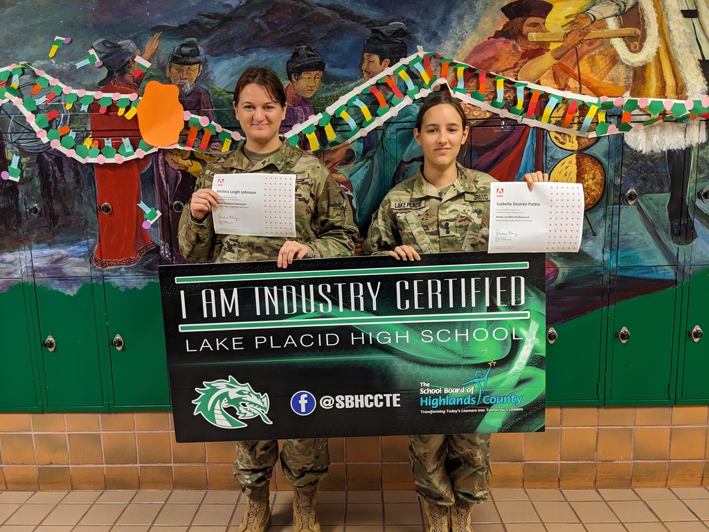 Students holding certificate.