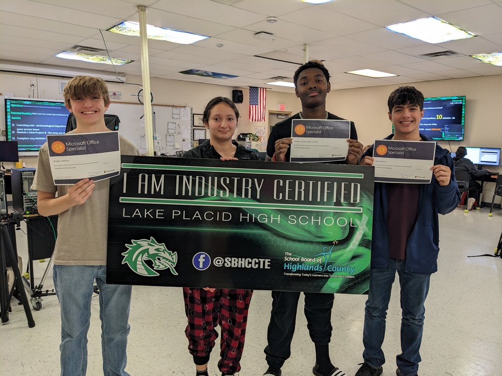 Students holding certificate.