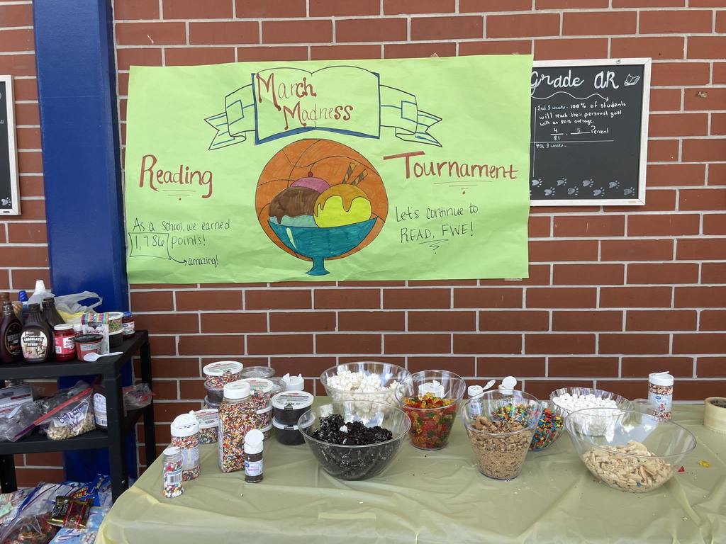 March Madness sign and toppings table