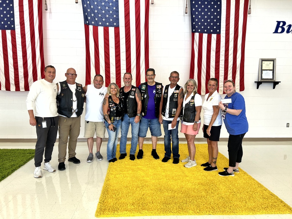 Picture of American Legion group with MES admin dropping off their donation