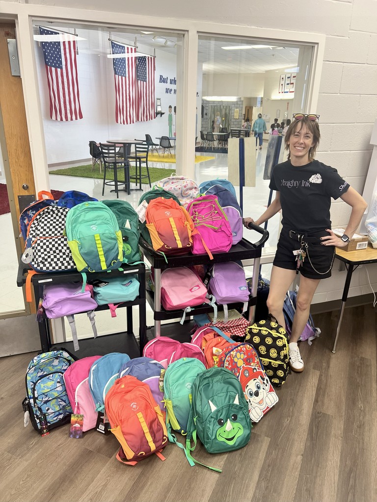 picture of lady with backpacks donations