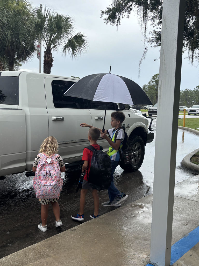 photo of safety patrol helping child ren in truck