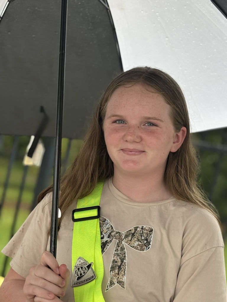girl smiling under umbrella