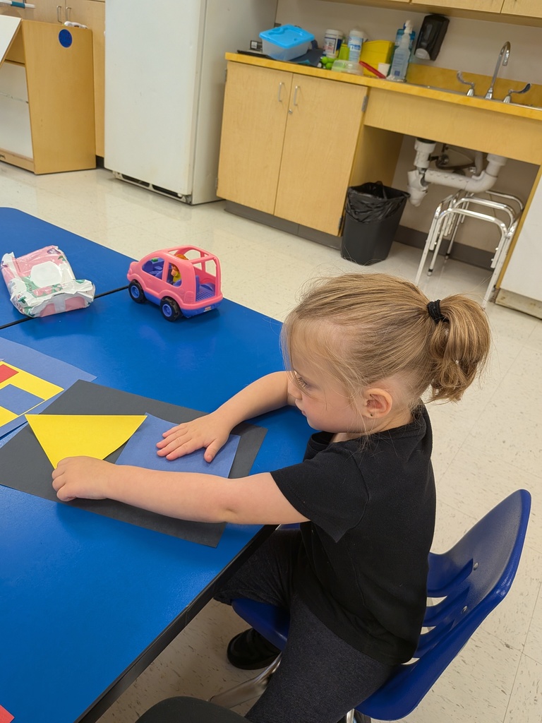 Students working hard with shapes and Mat Man