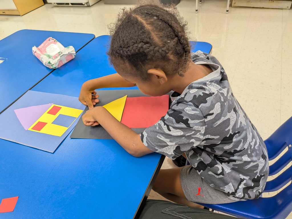 Students working hard with shapes and Mat Man