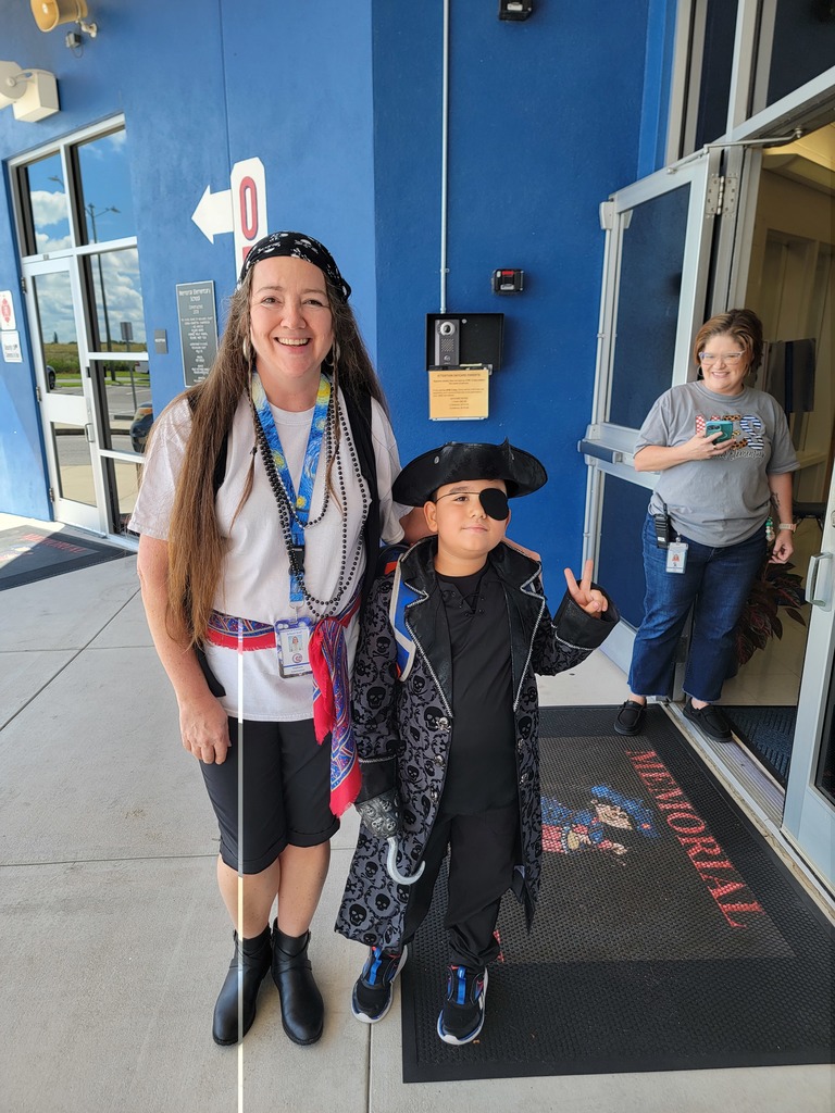 teacher with students dressed up as pirates