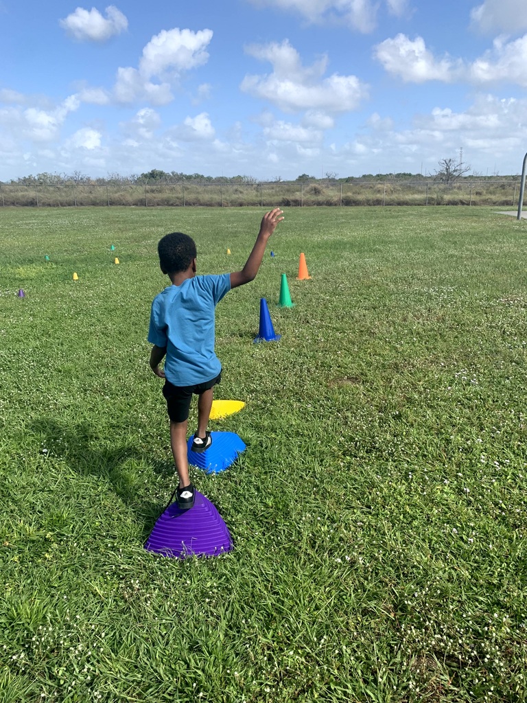 MES Students at PE doing the Constitution Obstacle Course with throwing, catching and much more.