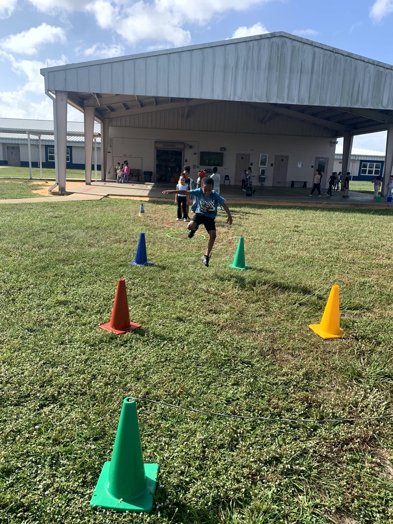 MES Students at PE doing the Constitution Obstacle Course with throwing, catching and much more.