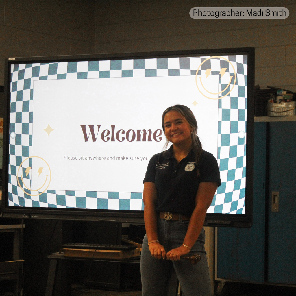 Female student in front of Newline board