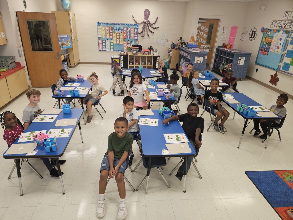 MES Kindergarten class learning about plants and eating a whole plant.