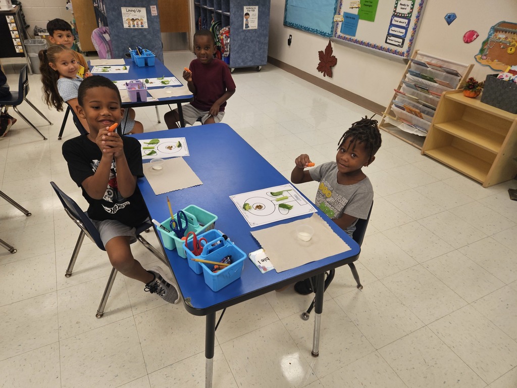 MES Kindergarten class learning about plants and eating a whole plant.