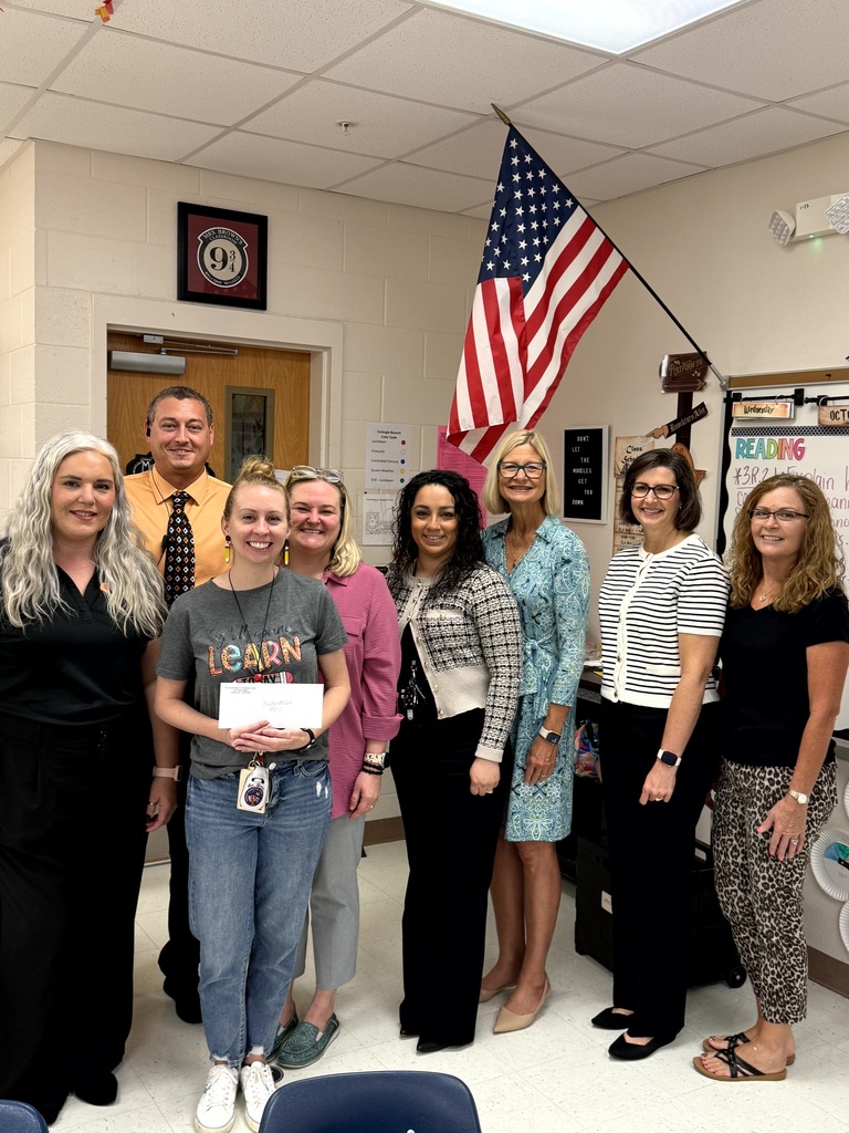Mrs. Brown with a group of people celebrating her grant win.