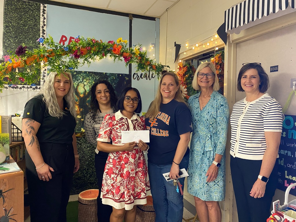 Ms. Mays  with admin and grant presenters getting her mini- grant.