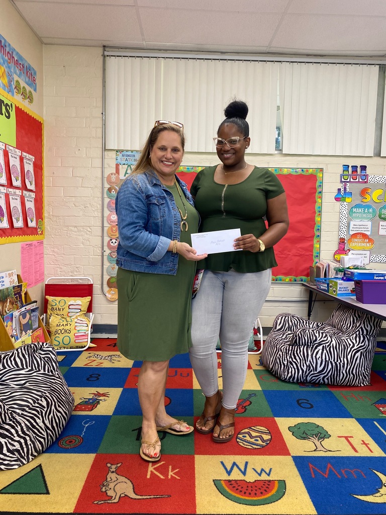 Ms. Davis  with admin getting her mini- grant.