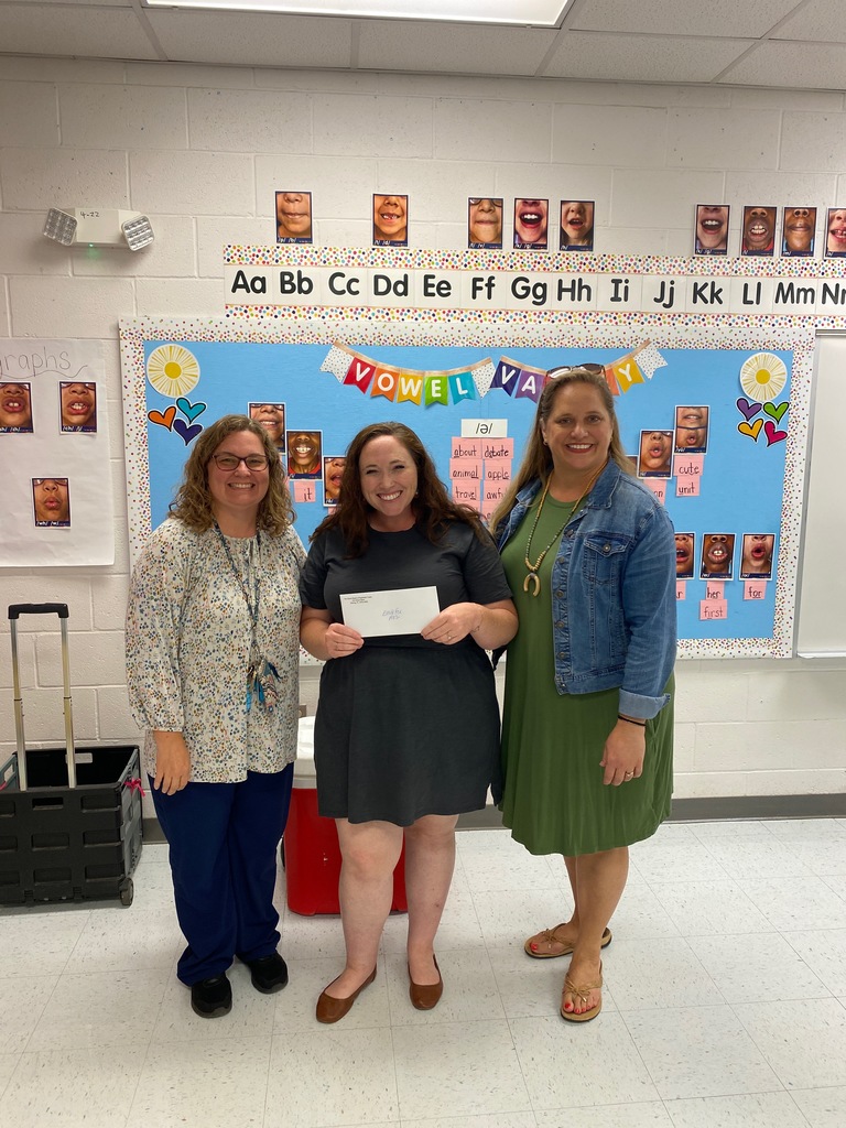 Mrs. Fox with admin getting her mini- grant.