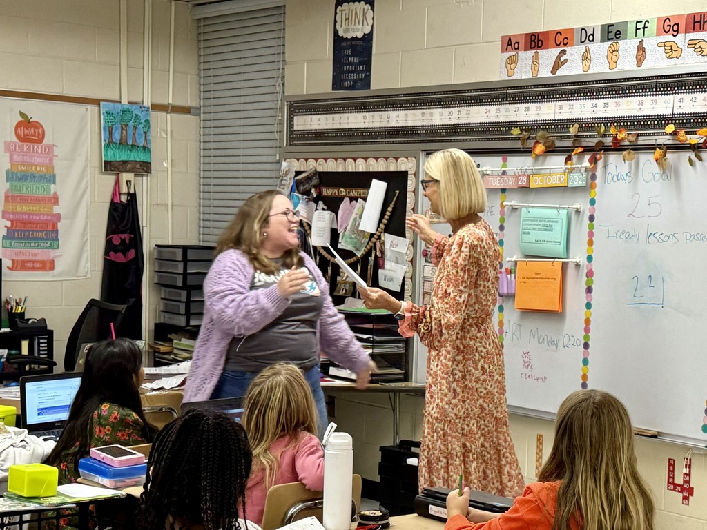 SBHC employee presenting CTE emplyee with mini grant award