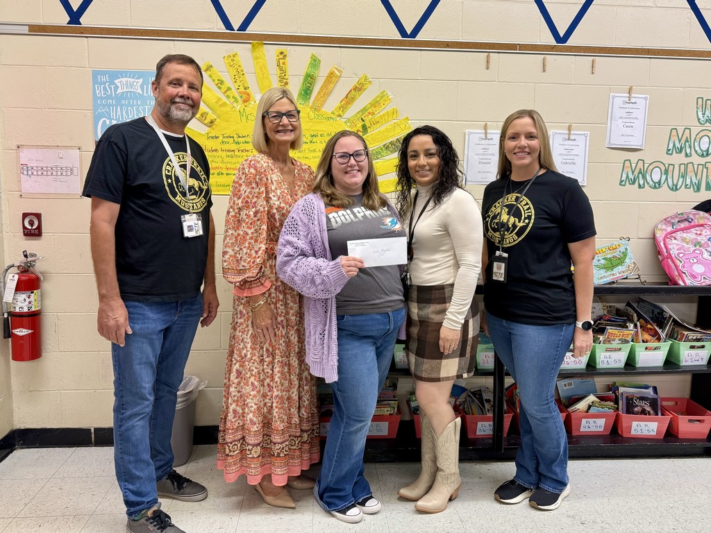 SBHC employees presenting CTE emplyee with mini grant award