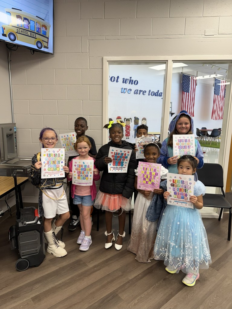 MES Red Ribbon Week coloring contest winners with their artwork.