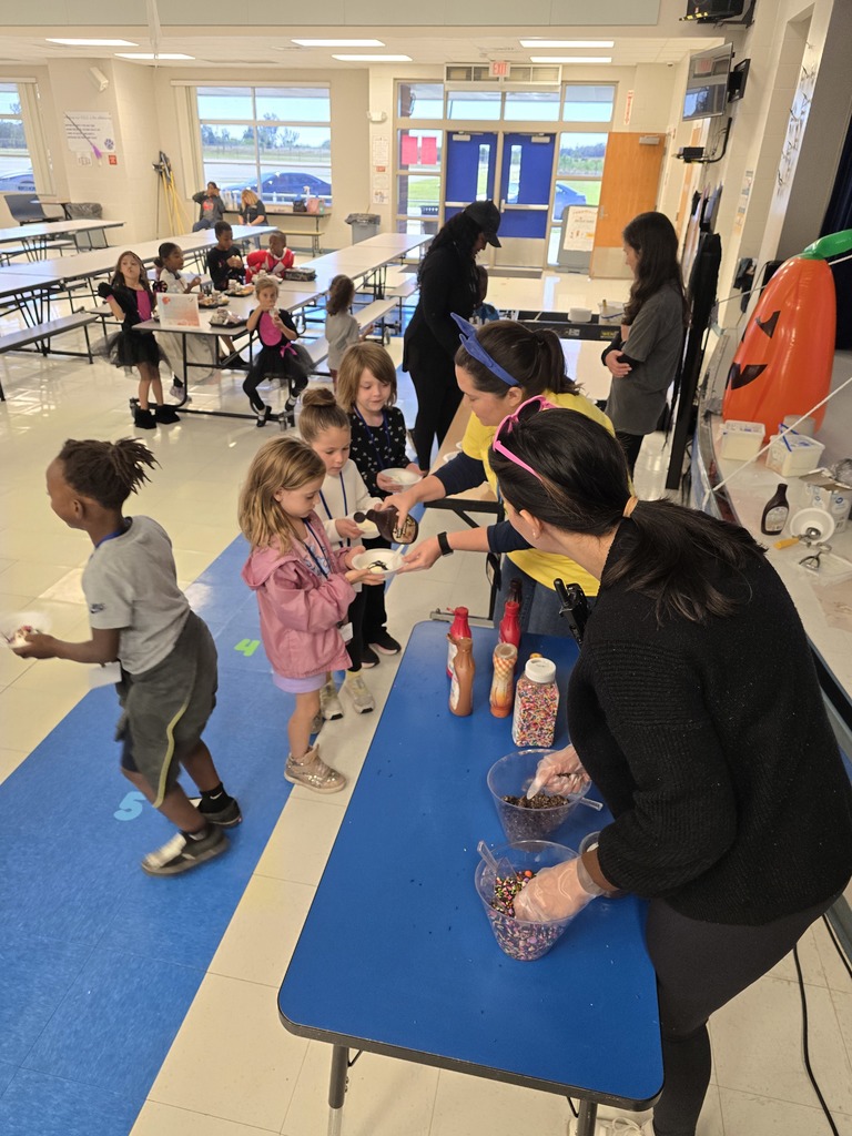 Students enjoying ice cream during the PBIS reward event.