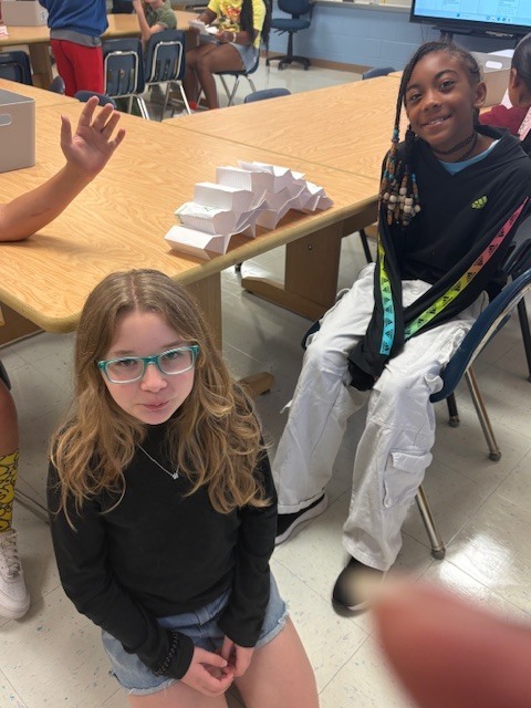 MES Students in STEM lab building Card Towers to deepen understanding of Scientist. 