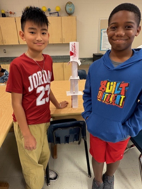MES Students in STEM lab building Card Towers to deepen understanding of Scientist. 