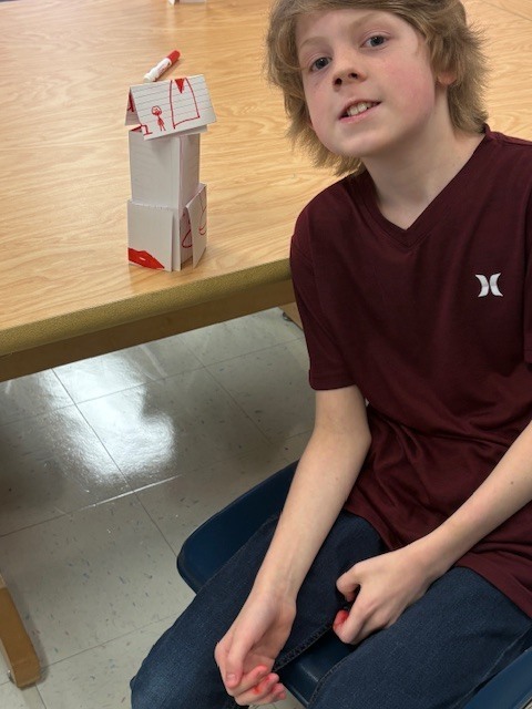 MES Students in STEM lab building Card Towers to deepen understanding of Scientist. 