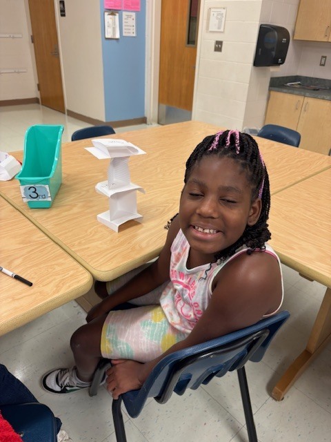 MES Students in STEM lab building Card Towers to deepen understanding of Scientist. 