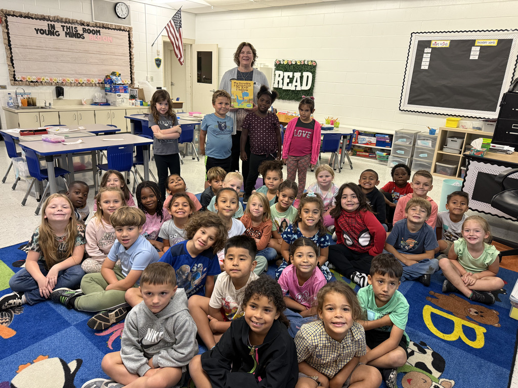 students smiling with reader