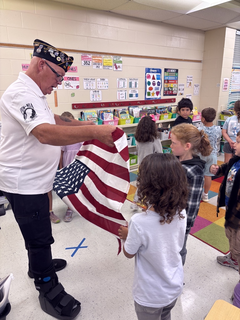 VFW Legionnaires teaching students flag etiquette.