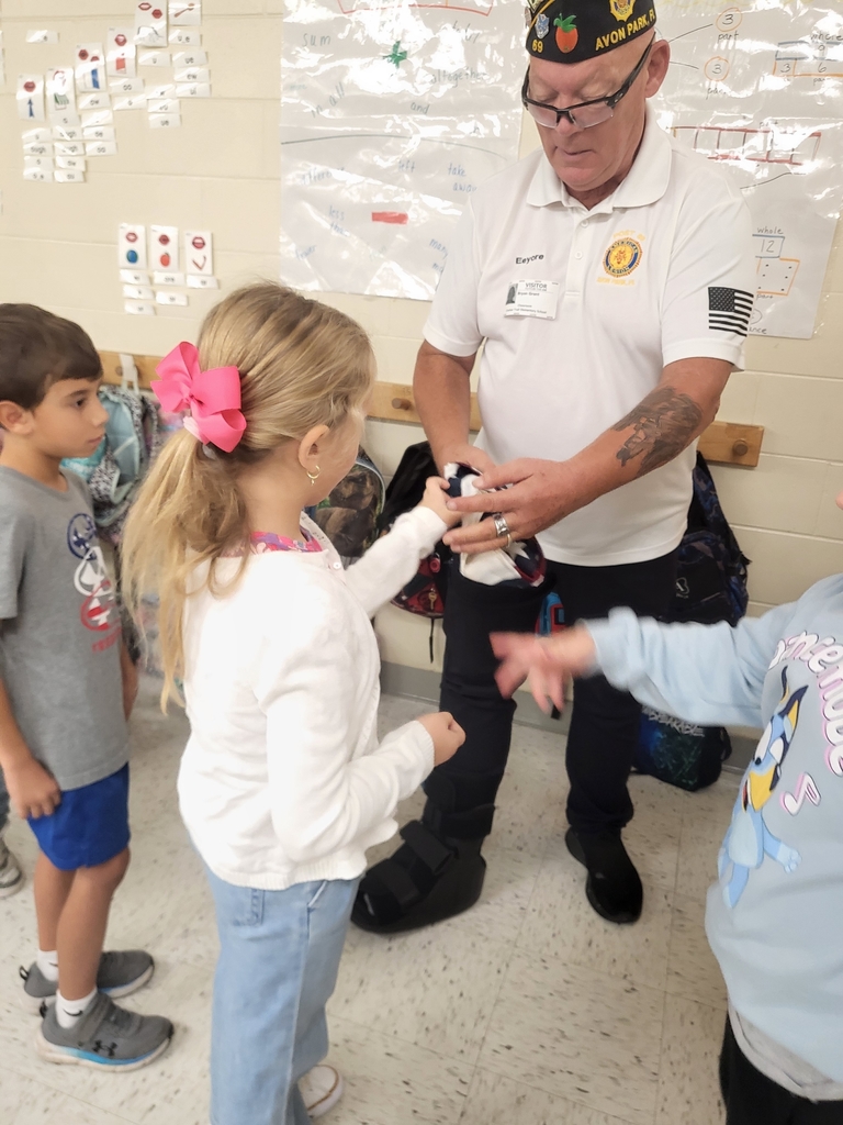 VFW Legionnaires teaching students flag etiquette.