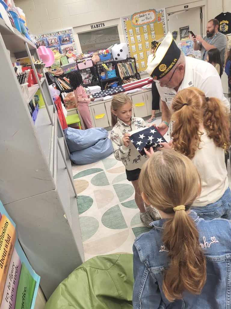 VFW Legionnaires teaching students flag etiquette.