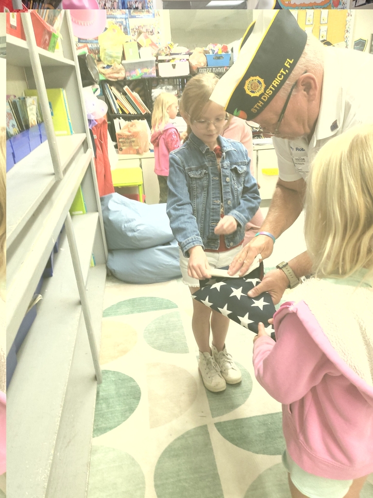 VFW Legionnaires teaching students flag etiquette.