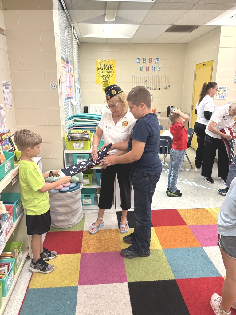 VFW Legionnaires teaching students flag etiquette.